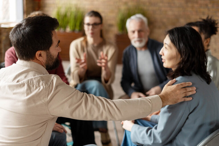 A man and woman in a adult group therapy session. | Healnex
