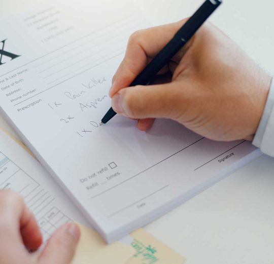 Doctor writing prescription for medication management | Healnex